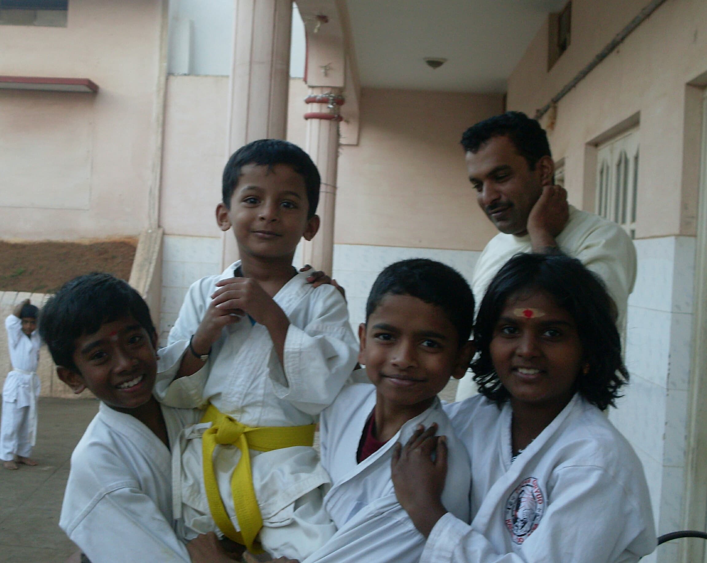 Sensei with Little Karatekas — Smiles at the Dojo