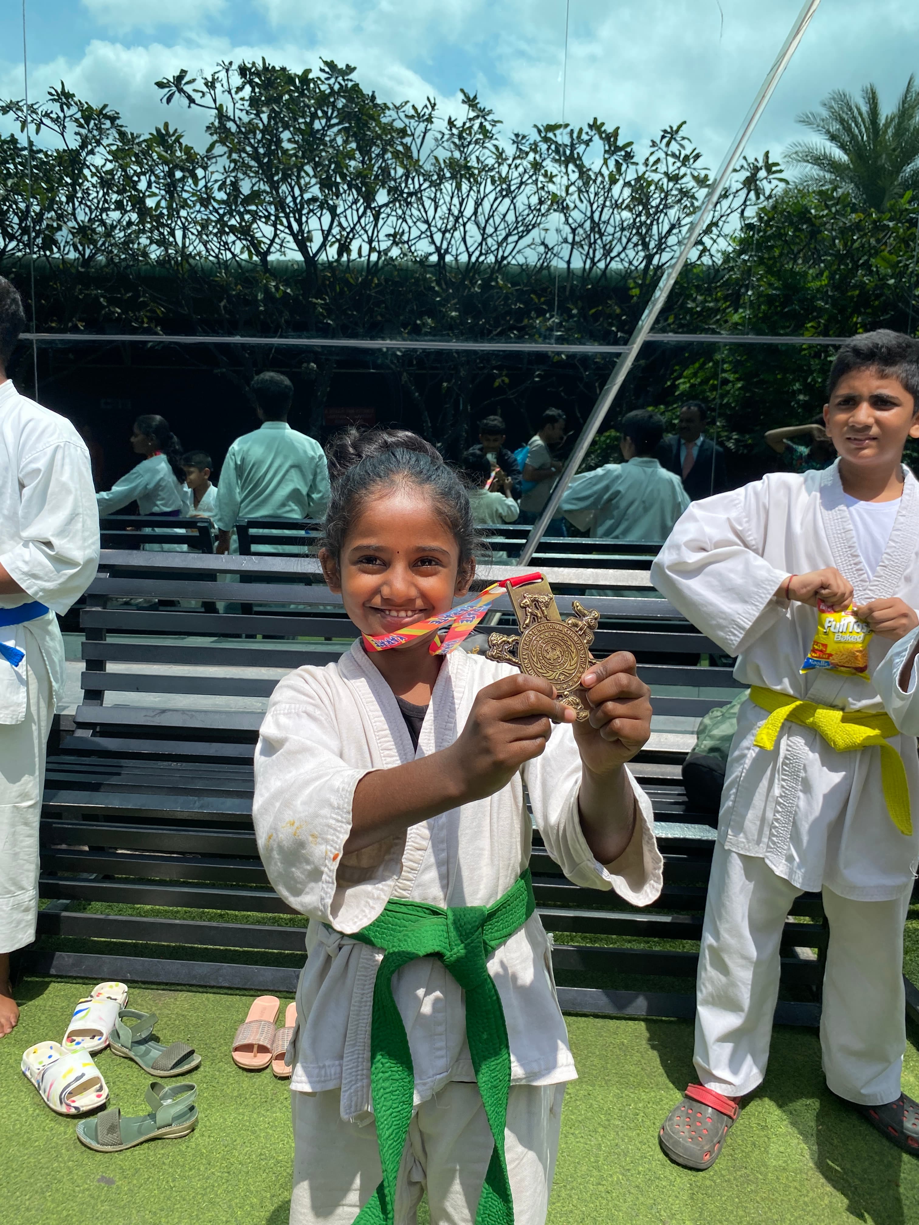 A Proud Champion Flashes Her Gold Medal